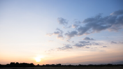 Beautiful sky and cloud at high. Landscape include space, light of nature, sunset, sunrise, horizon or skyline. Colorful with yellow, orange and blue at evening in autumn for background and wallpaper.