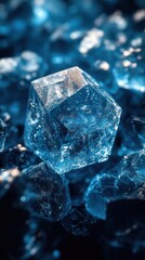 Close-up of a clear blue crystal on a textured surface.