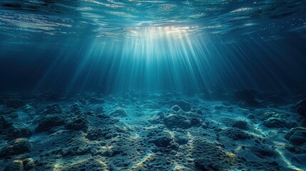Obraz premium Sunbeams Illuminate Underwater Rocky Ocean Floor