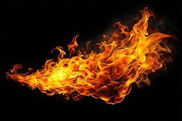 Fototapeta premium Black background highlights fierce flame silhouette.