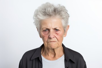 Sad homeless Caucasian bruising senior woman portrait on white background. Elderly gray hair female looking frustrated, alcoholic, stressed, unhappy and annoyed, Domestic Violence and Emotional Abuse