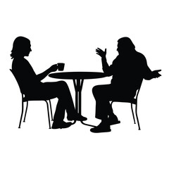 Two people sitting at a table. One of them is holding a cup. The table is round