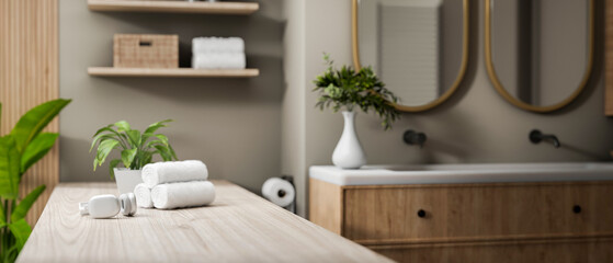 A close-up of a space on a minimal wooden bathroom tabletop in a modern elegant bathroom.