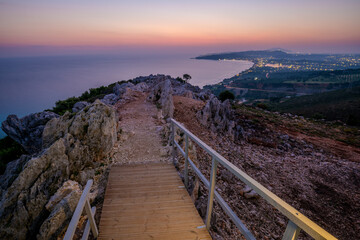 Sunrise over the island of Zakhyntos from a vantage point on the rocks