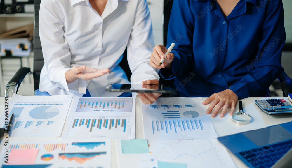 Poster business documents on office table with smart phone and calculator digital tablet and graph business