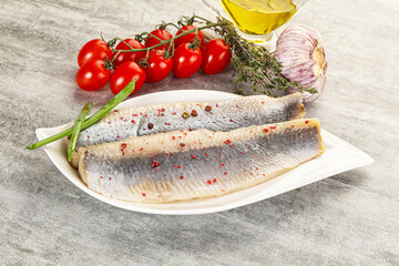 Marinated herring fillet with green onion