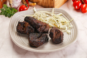 Grilled beef barbecue served onion