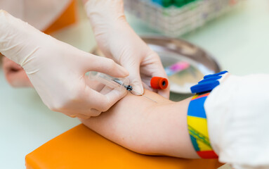 Child getting vaccinated at clinic today. A healthcare professional administers a vaccination to a child in a bright medical clinic setting.
