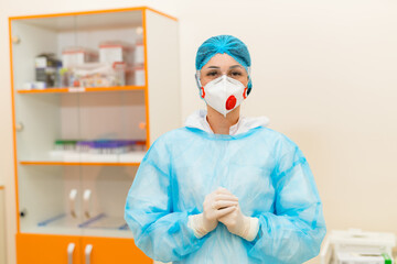Medic in protective gear at healthcare site. A healthcare worker is dressed in full protective...