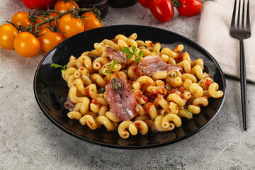 Italian pasta cellentani with anchovy