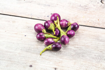 Small organic young purple round eggplant