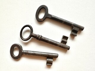 Old iron key on a white background