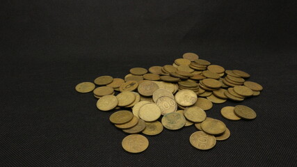 Stack of five hundred rupiah yellow Indonesian coins