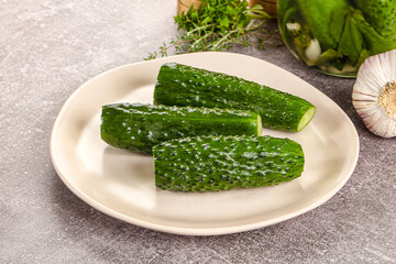 Homemade lighty salted cucumbers with herbs