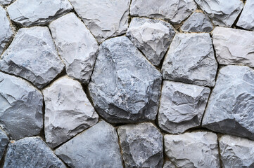 Part of a stone wall, gray color of background or texture, modern style design decoration.