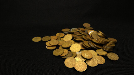 Stack of five hundred rupiah yellow Indonesian coins
