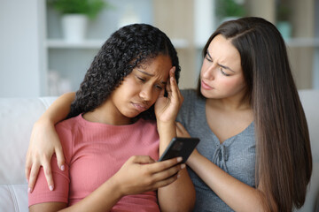 Sad black woman complaining and her friend comforting
