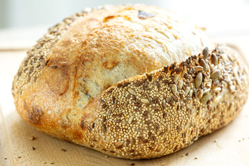 Homemade bread, sourdough wheat loaf with seeds