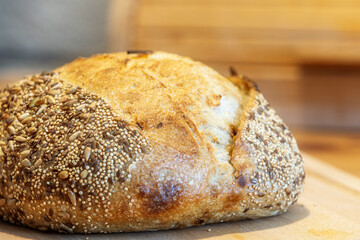 Homemade bread, sourdough wheat loaf with seeds