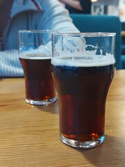 Cold dark beer in glasses at a bar. 