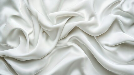Obraz premium Elegant, flowing white fabric with soft, smooth textures creating a luxurious visual appeal.