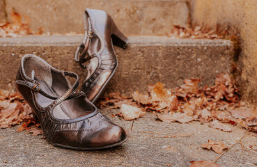 Retro style heel shoes. Sepia tones background. Vintage mood - old 1920s fashion.