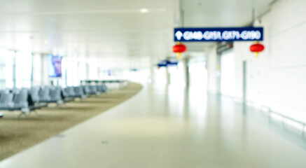 BLURRED OFFICE BACKGROUND, MODERN BUSINESS HALL WITH LIGHT REFLECTONS ON THE FLOOR,abstract blur in airport for background.