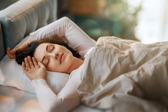 woman is sleeping in the bedroom