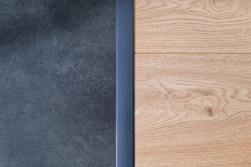 Anthracite expansion strip between ceramic tiles and floor panels. Aesthetic floor finishing. finishing strip. Interior