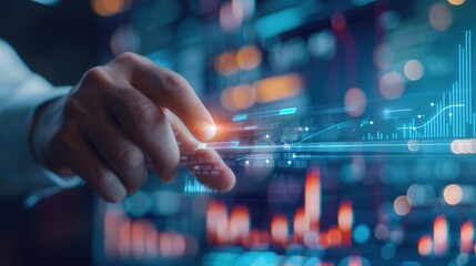 Close-up of a hand pointing at a futuristic digital screen with data visualizations, charts, and glowing analytics in blue tones.