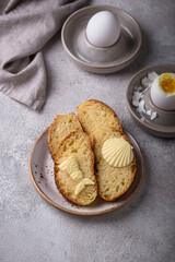 Breakfast with boiled eggs, bread and butter