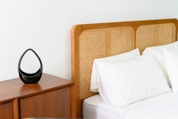 Minimalist bedroom with wooden headboard and modern decor