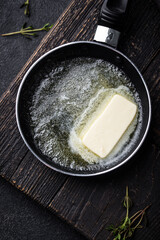 Melted butter on in iron pan