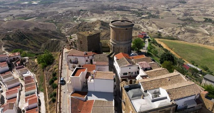 San Basilio Castle Over The Hilltop Town Of Pisticci In Matera Province, Basilicata, Italy. Aerial Drone Shot