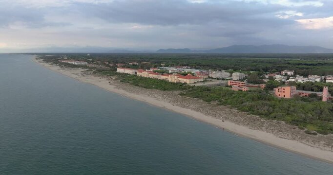 Aerial drone view over the beach and hinterland of Livorno, showcasing stunning coastal and inland scenery