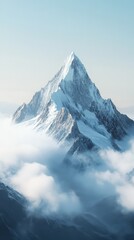 Obraz premium Breathtaking mountain peak surrounded by soft clouds under a clear blue sky, evoking serenity and natural beauty.