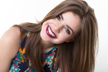 Close up portrait of happy woman face expresses positive emotions  isolated over white background feels playful