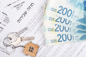 Rental or Residential Lease agreement, magnifying glass, Shekels money cash, and house keys. Short and long term rentals, housing searching crisis in Israel, signing contract, and rising prices.