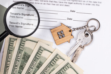 Rental or Residential Lease agreement contract, magnifying glass, dollar money cash, and house...