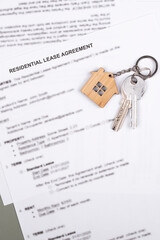 Rental or Residential Lease agreement contract and house keys. Short and long term rentals, housing searching crisis, signing lease agreement, and rising prices.