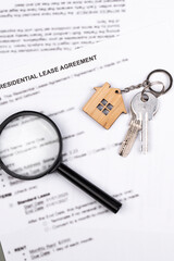 Rental or Residential Lease agreement contract and house keys. Short and long term rentals, housing searching crisis, signing lease agreement, and rising prices.