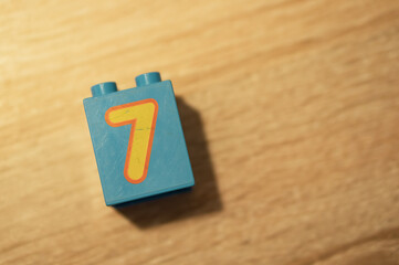 Fototapeta premium Blue Lego Duplo block with the number 7