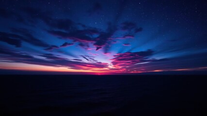 Obraz premium Deep blues and purples dominate the sky as a stunning sunset gives way to starry darkness over vast ocean, ocean breeze, clouds, cliffside