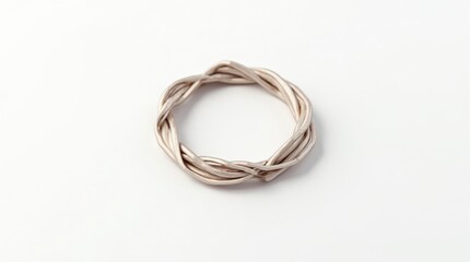 Naklejka premium Silver braided ring on white background, minimalist jewelry, top view