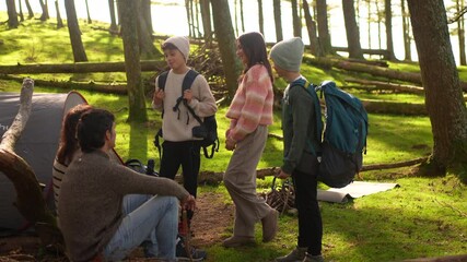 Caucasian family during a meeting at camping weekend in the forest