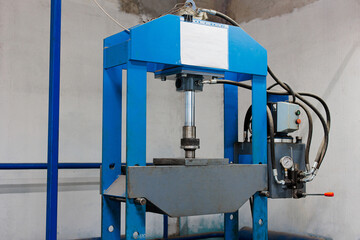 Power in Compression: A Hydraulic Press in Action, Showcasing Industrial Strength and Precision...