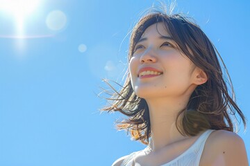 Beautiful Japanese woman on a sunny day with a vibrant blue sky