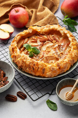Delicious homemade apple galette with flaky crust, topped with almonds and honey