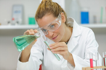 laboratory assistant analyzing a blood sample