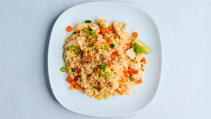 Khao Pad with Chicken – A classic Thai fried rice dish with tender chicken, fragrant jasmine rice, vegetables, and a savory sauce, creating a delicious, flavorful, and satisfying meal.